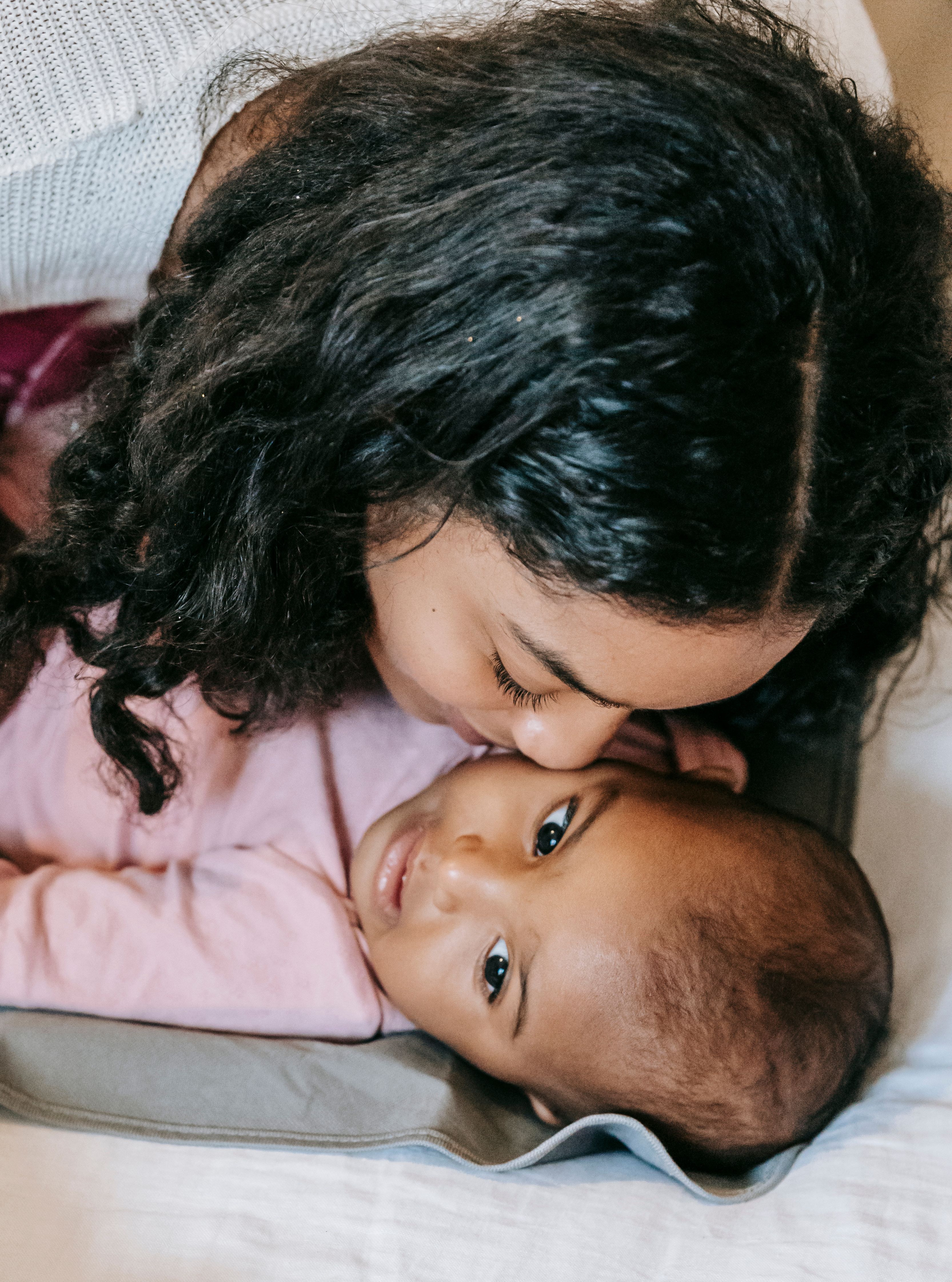 Black mother holding her baby